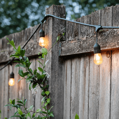 Solar festoon lights in Australia hung on a wooden fence